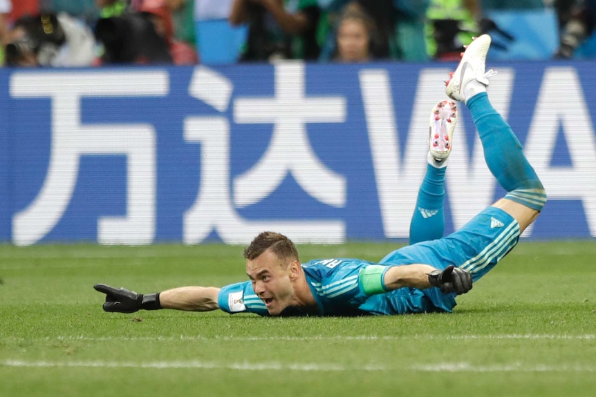 Russia's Igor Akinfeev celebrates penalty shootout win over Spain