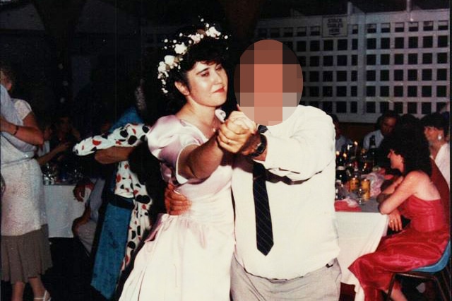 Julie Hutchinson dances with a person at a wedding, date unknown.