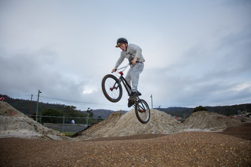 Tyler Moles gets some air with his push bike on the new pump track in Risdon Vale.