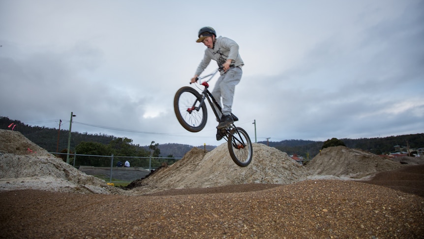 Tyler Moles gets some air with his push bike on the new pump track in Risdon Vale.