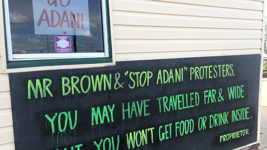 Signs saying Go Adani and Mr Brown & Stop Adani protesters on a pub in Clermont in central Queensland.