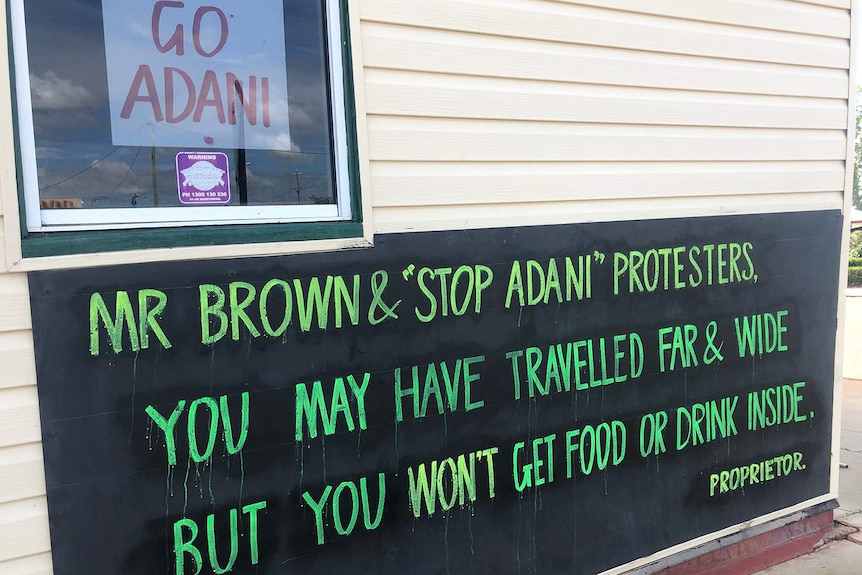 Signs saying Go Adani and Mr Brown & Stop Adani protesters on a pub in Clermont in central Queensland.