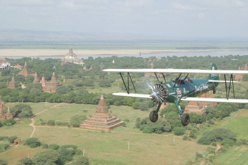 Tracey Curtis-Taylor flies her Boeing Stearman over temples in Bagan, Burma en route to Australia.