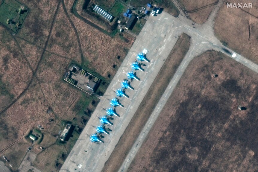 Su-34 fighter deployment can be seen in a line formation.