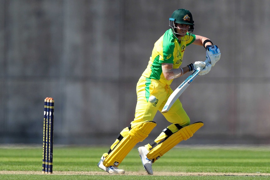 A batsman dabs the ball on the off-side during a warm-up game.