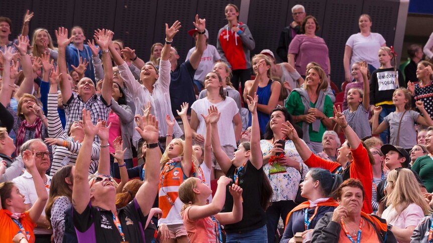 Crowd reacts during Super Netball clash