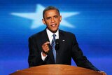 US President Barack Obama speaks on stage as he accepts the nomination for president