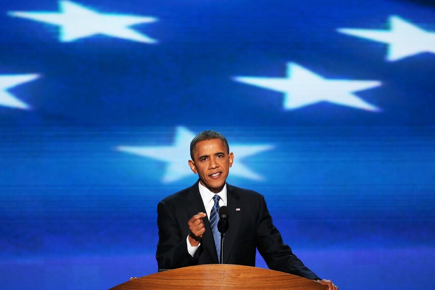 US President Barack Obama speaks on stage as he accepts the nomination for president
