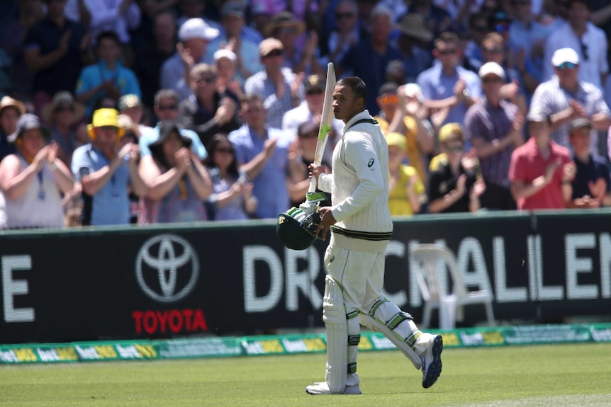 Australia's Usman Khawaja acknowledges the crowd after being dismissed for 145 at Adelaide Oval