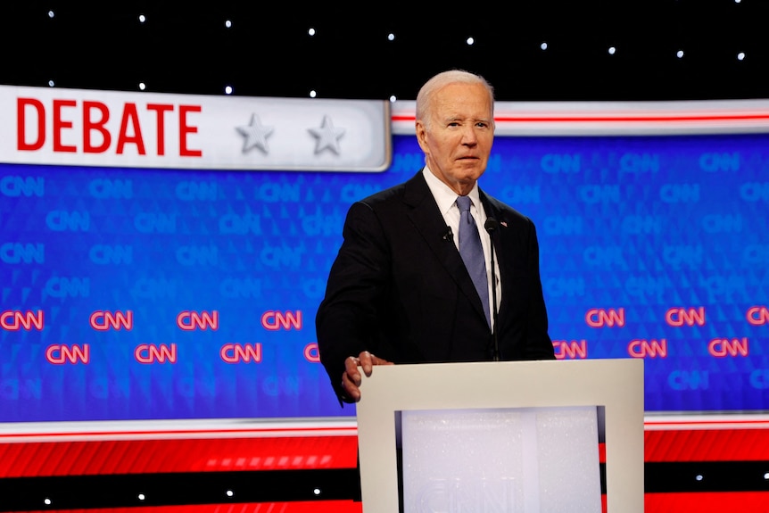 Joe Biden stands at a podium at the CNN presidential debate