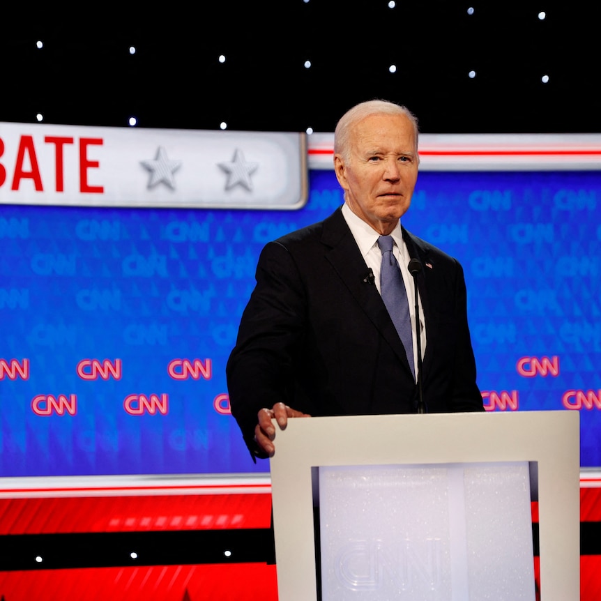Joe Biden stands at a podium at the CNN presidential debate