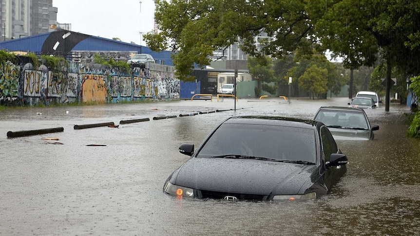 Car submerged in streets flooded in woolloongabba