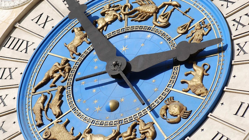 an astronomical clock with all the star signs around the outside aligning with months