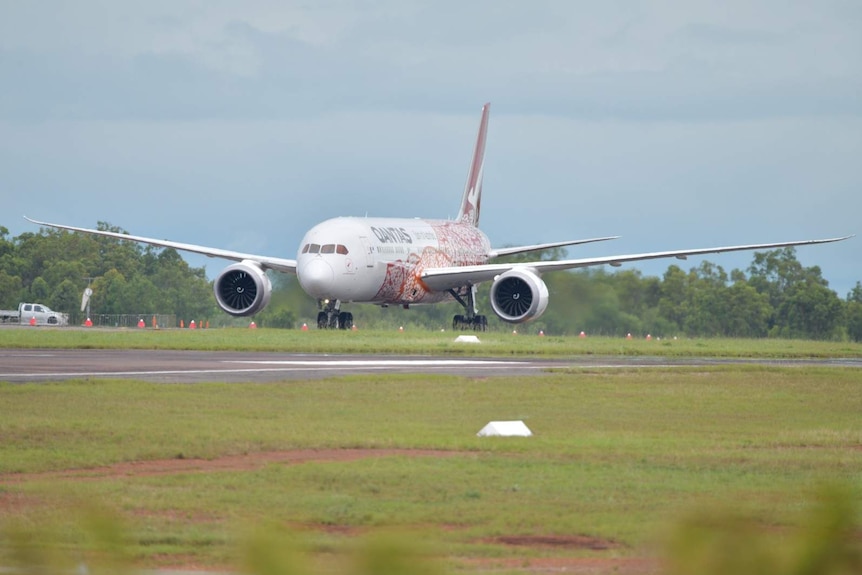 A QANTAS flight taxis along the runway at the Darwin airport.