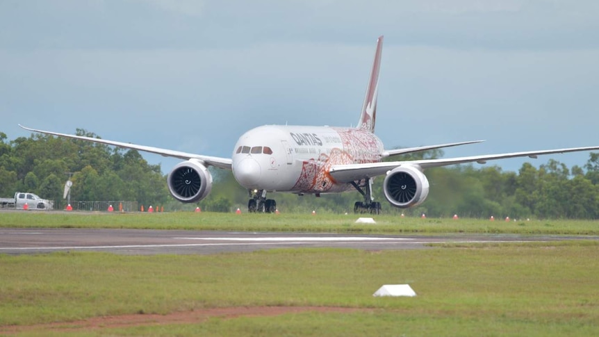 A QANTAS flight taxis along the runway at the Darwin airport.