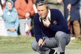 Arnold Palmer of the United States lines up a putt.