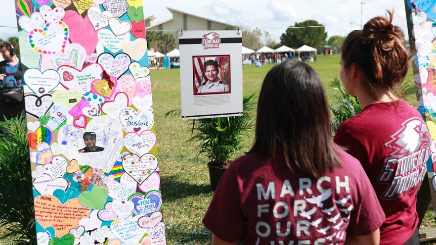 The memorial of Martin Duque Anguiano is observed by mourners