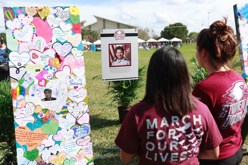 The memorial of Martin Duque Anguiano is observed by mourners