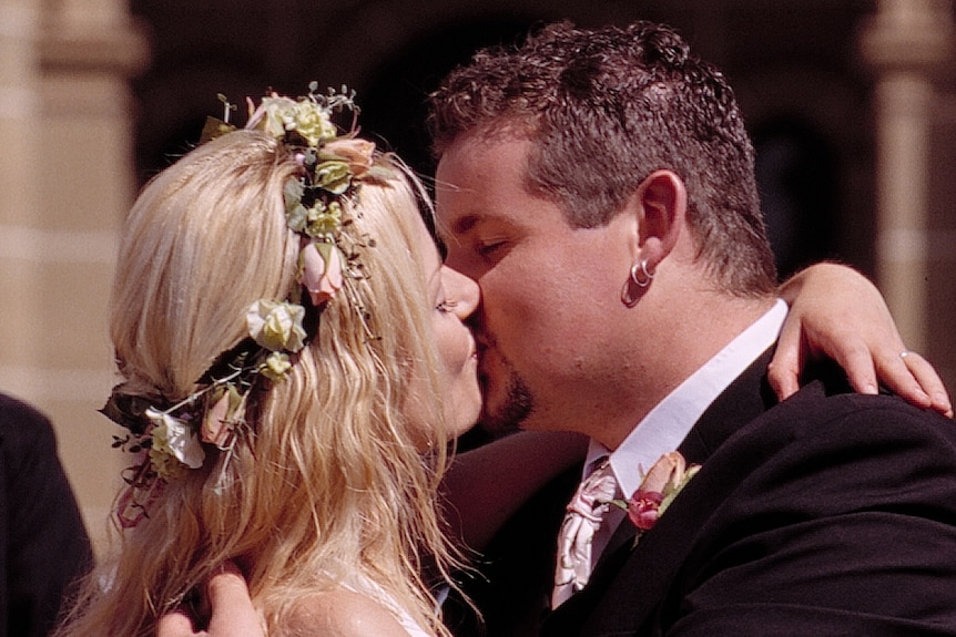 Neighbours characters Dee and Toadie share a kiss on their wedding day