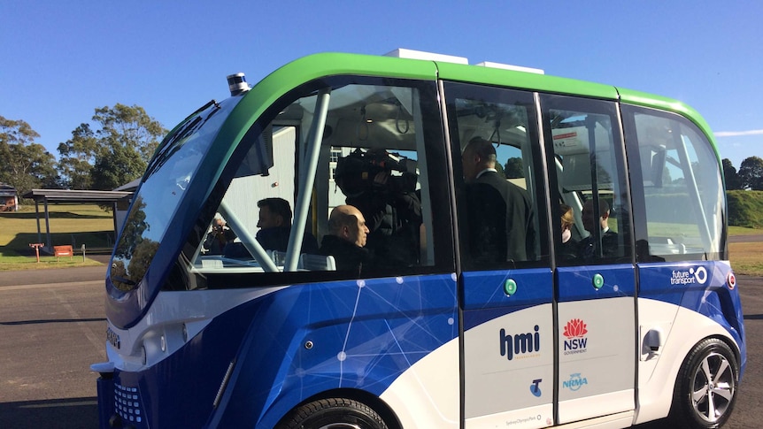 NSW ministers and media inside a driverless car.