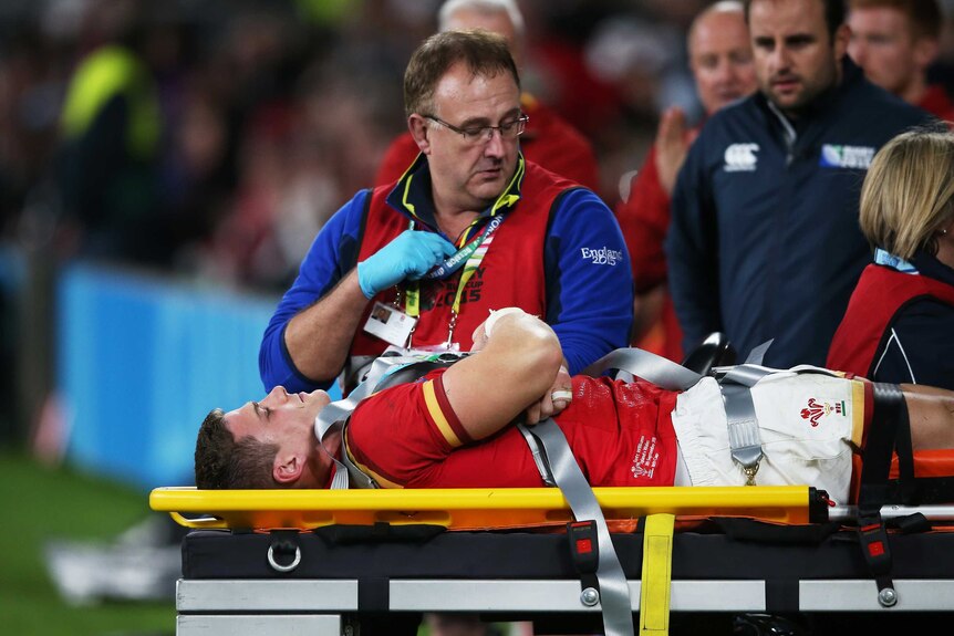 Wales centre Scott Williams leaves on a stretcher