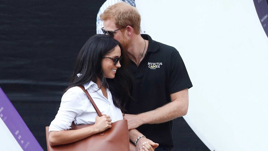 Prince Harry arrives with girlfriend Meghan Markle at the wheelchair tennis event.