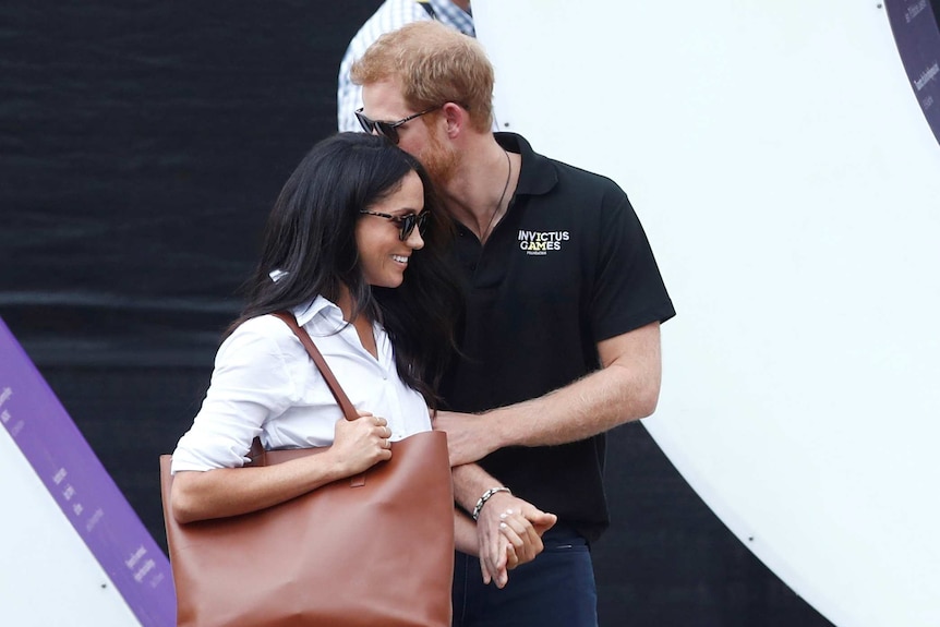 Prince Harry arrives with girlfriend Meghan Markle at the wheelchair tennis event.