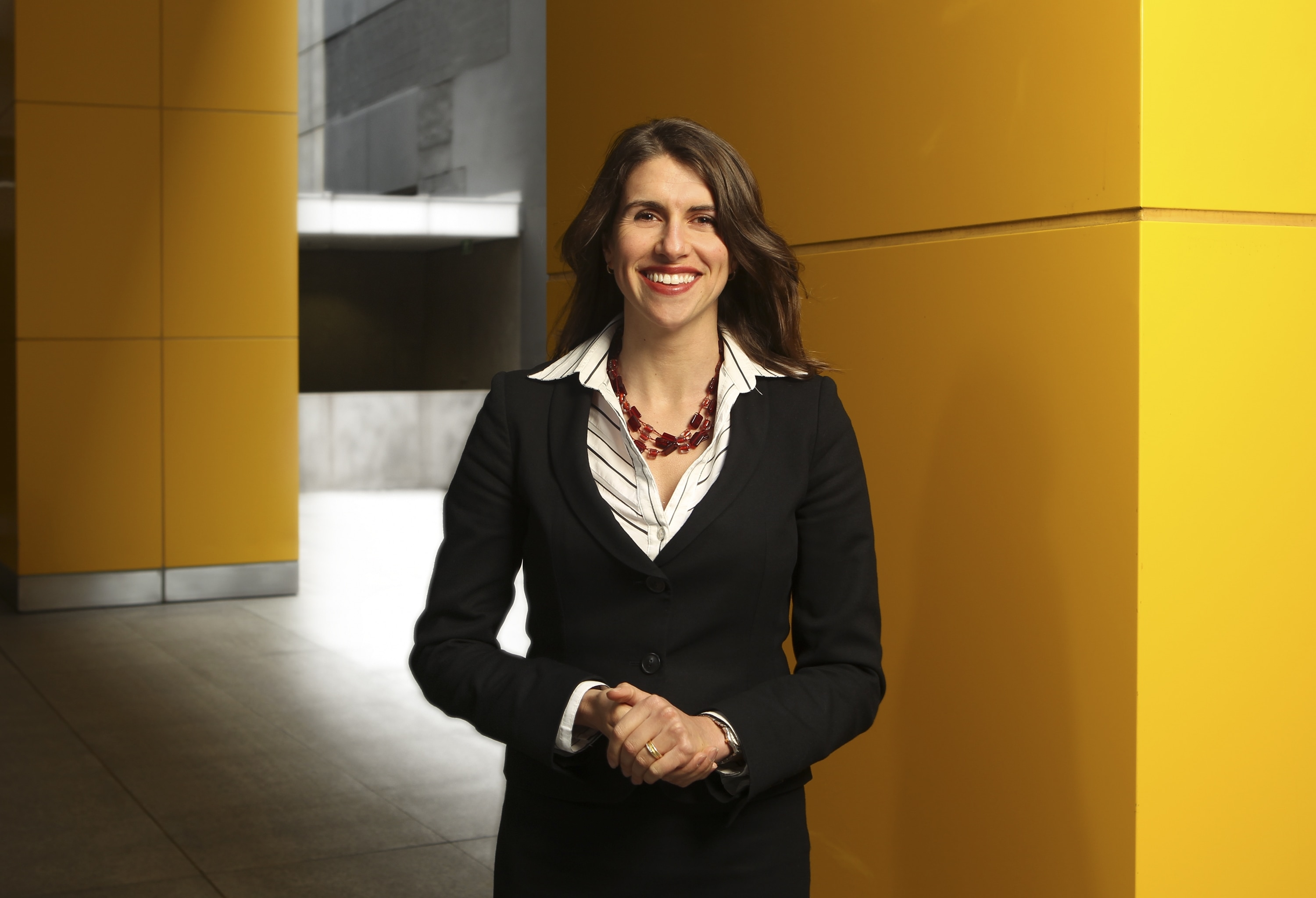 Woman stands facing camera