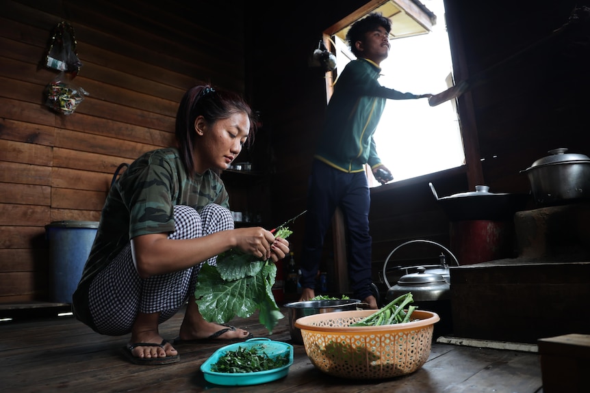 A woman preparing food.