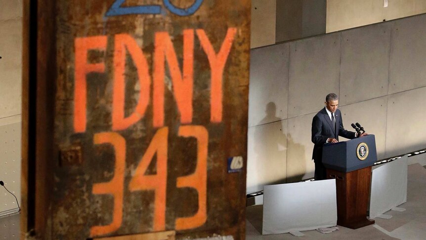 US President Barack Obama speaks next to part of the twin towers at the dedication ceremony.