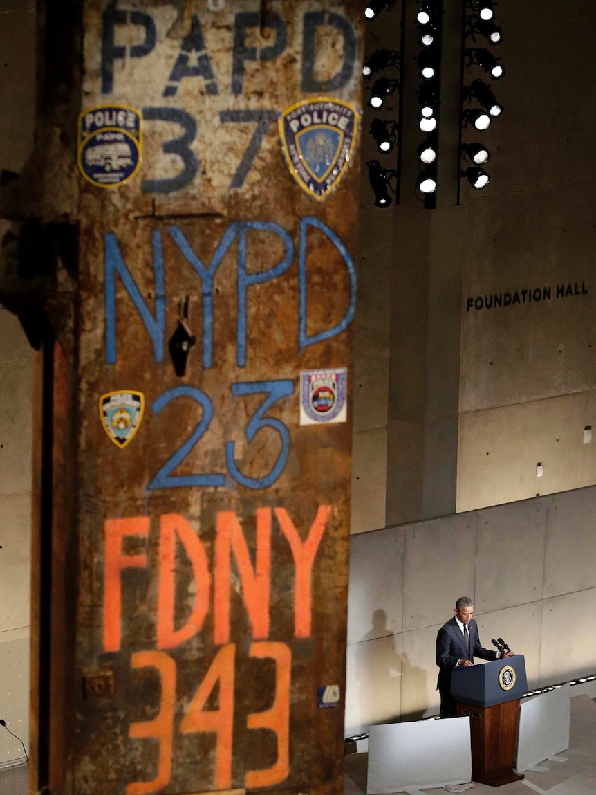 US President Barack Obama speaks next to part of the twin towers at the dedication ceremony.