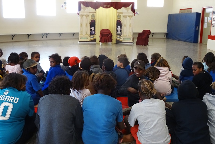Students from Ntaria wait for the pop-up performance of Coppelia