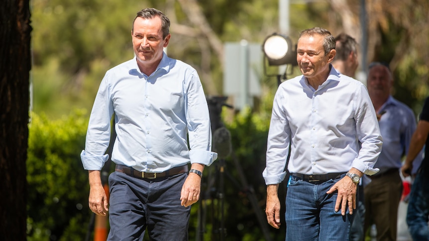 Mark McGowan and Roger Cook walking next to each other.