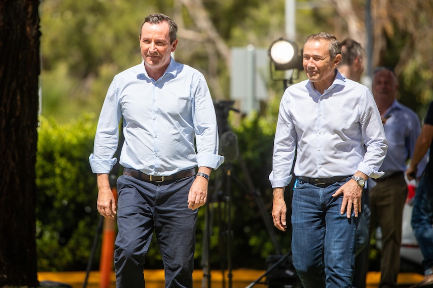 Mark McGowan and Roger Cook walking next to each other.