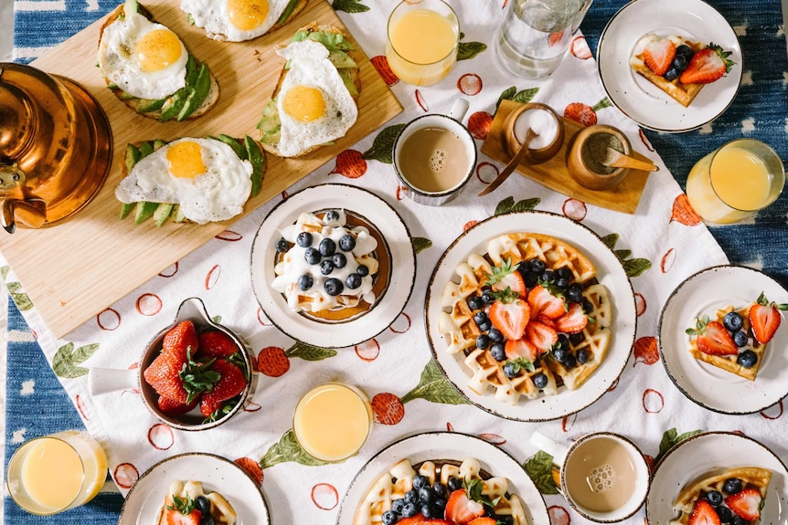 A table of different colourful breakfast foods and drinks