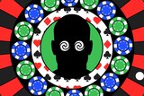 Roulette wheel with poker chips and male silhouette with swirling, hypnotised eyes to depict problem gambling.