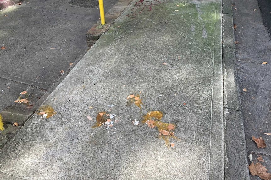 Eggs splattered on the footpath