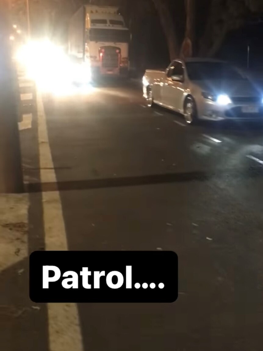 A screen shot of a photo showing cars on the road with the word 'patrol' typed in front