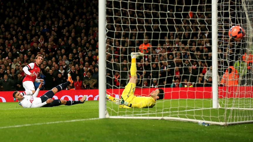 Arsenal's Santi Cazorla scores in the FA Cup tie against Tottenham Hotspur.