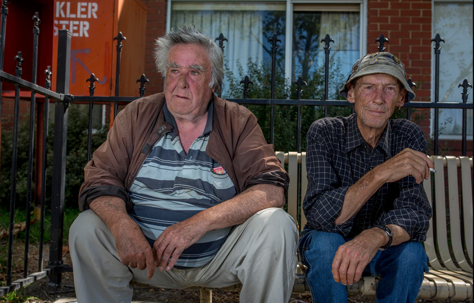 Noel and Gary sit out the front of Foley House, a Salvation Army accommodation facility for people who were previously homeless