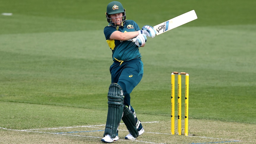 An Australian batter plays a pull shot in a women's T20 international against West Indies.