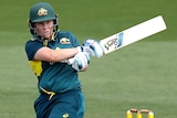 An Australian batter plays a pull shot in a women's T20 international against West Indies.