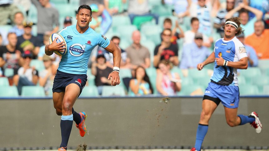 Hat-trick hero ... Israel Folau crosses to score his opening try