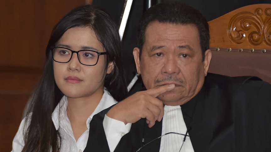 Jessica Wongso sits in court next to her lawyer Otto Hasibuan during her trial