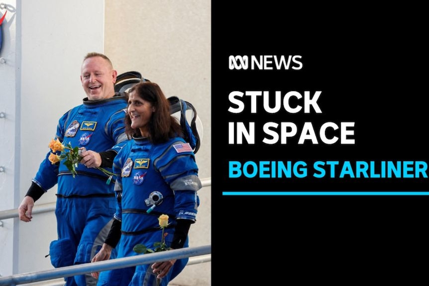 Stuck in Space, Boeing Starliner: Two astronauts in blue flight suits walking alongside each other.