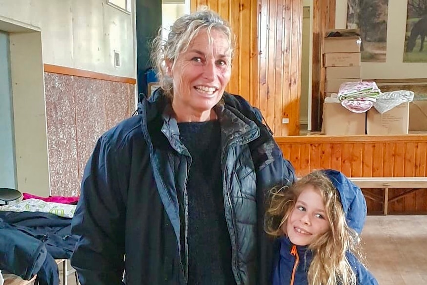 A mother and daughter in their donated coats.