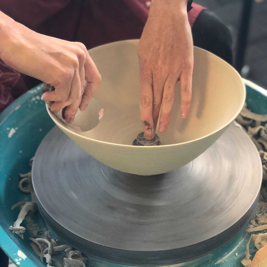 Shannon Garson at work at her pottery wheel