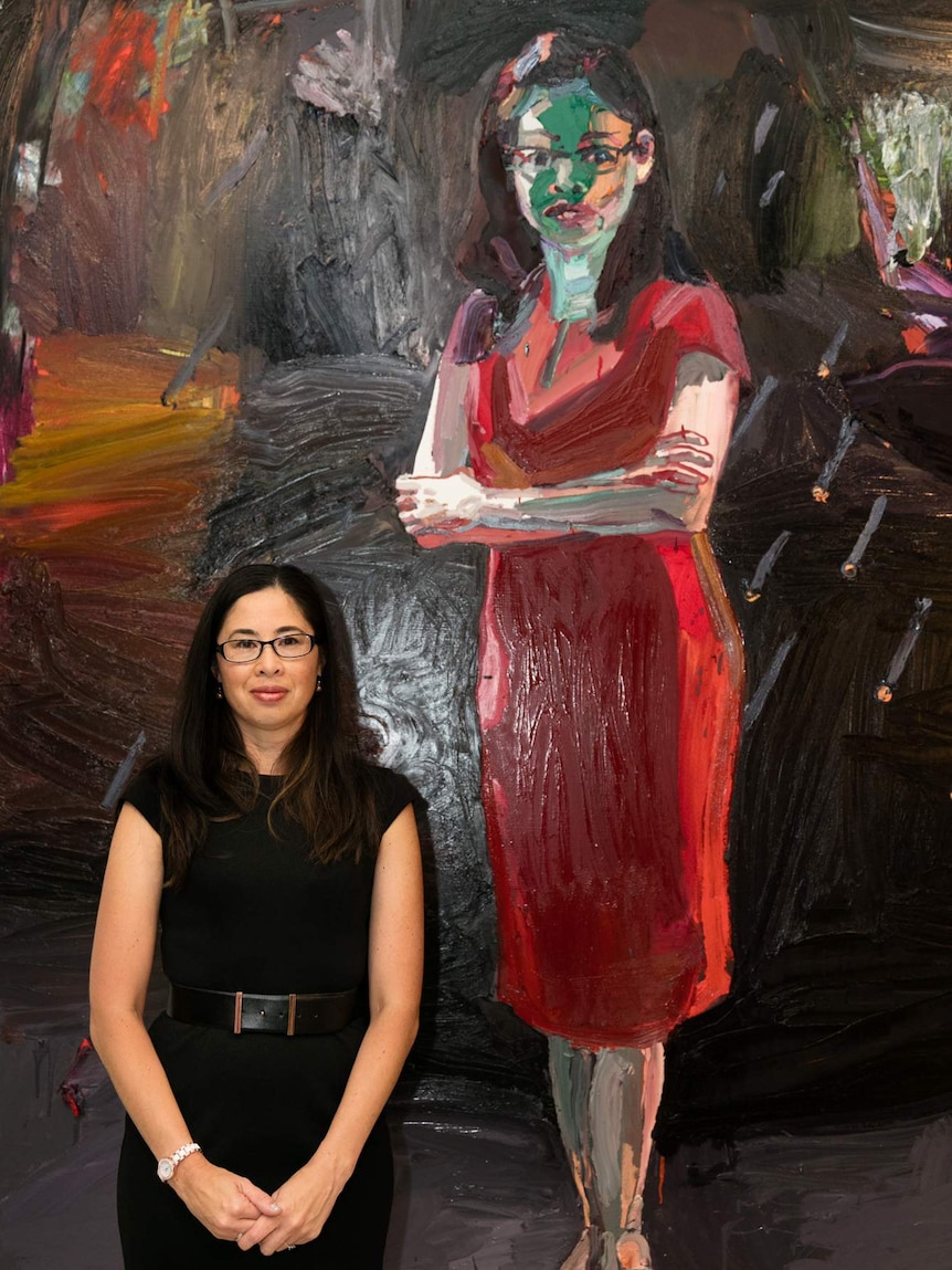 Leesa Kwok with her portrait by Ben Quilty at the Australian War Memorial