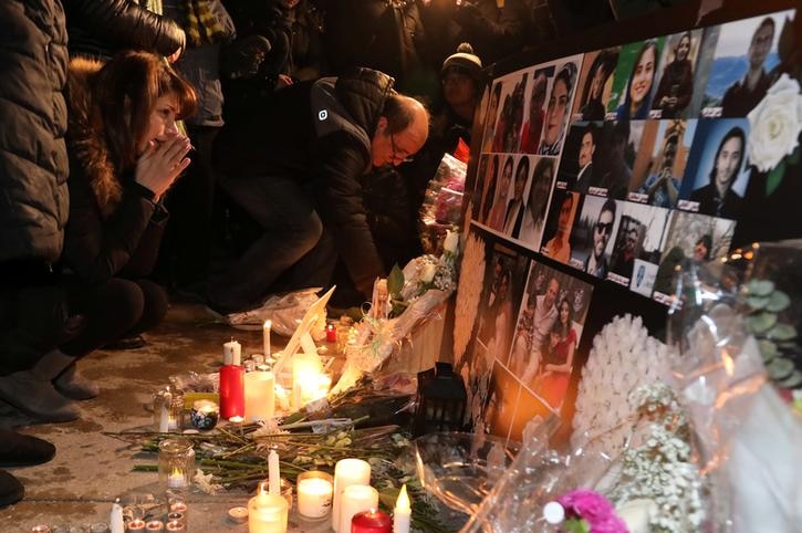 Mourners gather to pay tribute with candles and photos of victims of Ukrainian passenger jet which crashed in Iran.