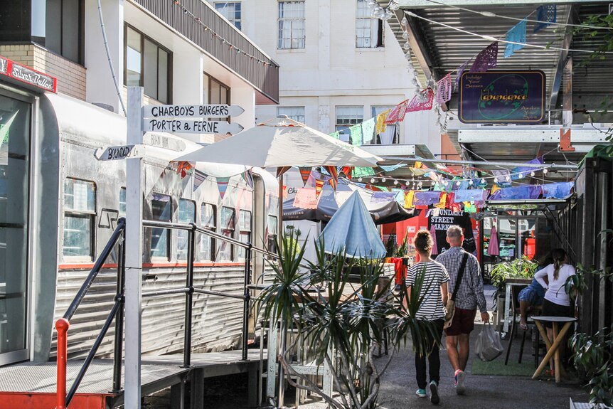 Visitors walk through the markets that serve as public space during non-market days.